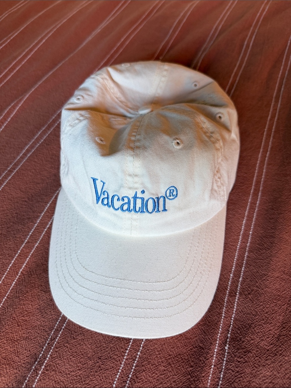 Vacation® Embroidered Cream Baseball Cap with Blue Lettering